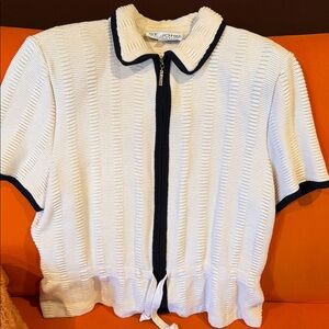 St. John creamand black knit top. Zipper closure. With shoulder pads
